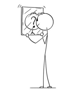 Man looking in the mirror unable to recognize himself in his reflection